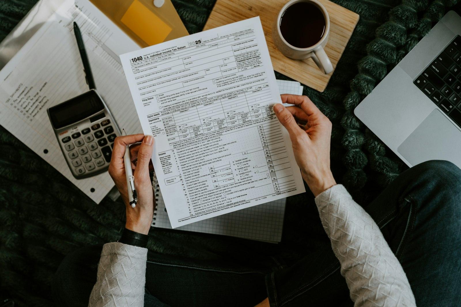 Hands reviewing tax forms