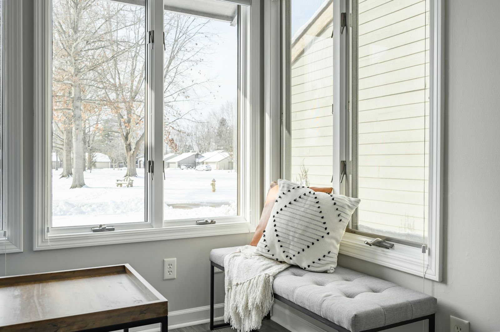 A bright window seat in a clean home
