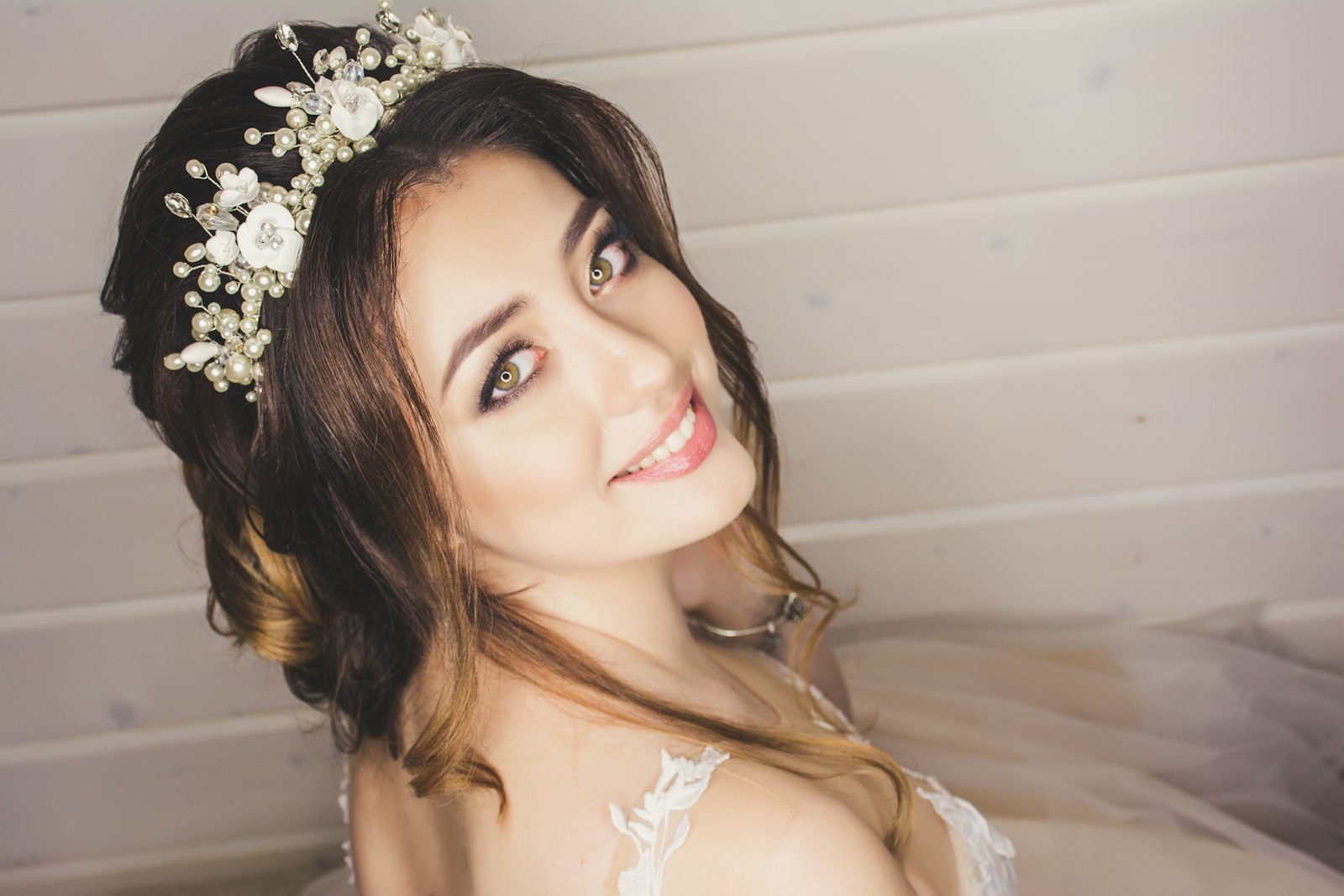 Smiling bride with floral hairpiece