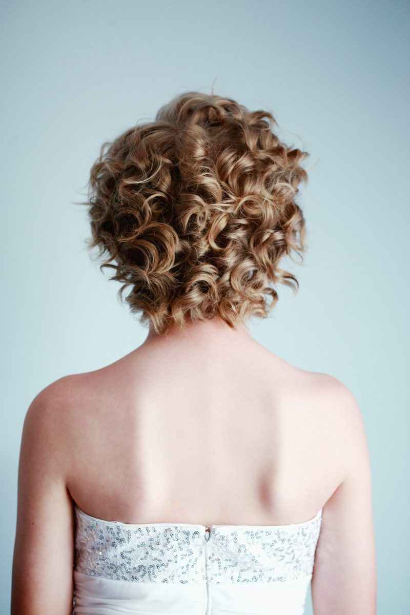 Woman wearing white strapless top