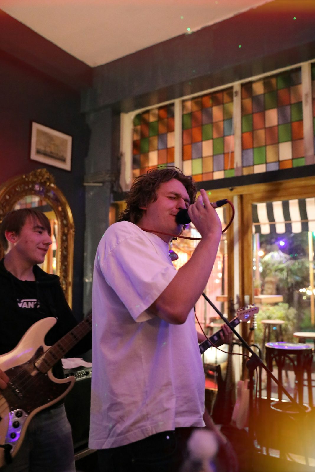 A band playing live on a small stage