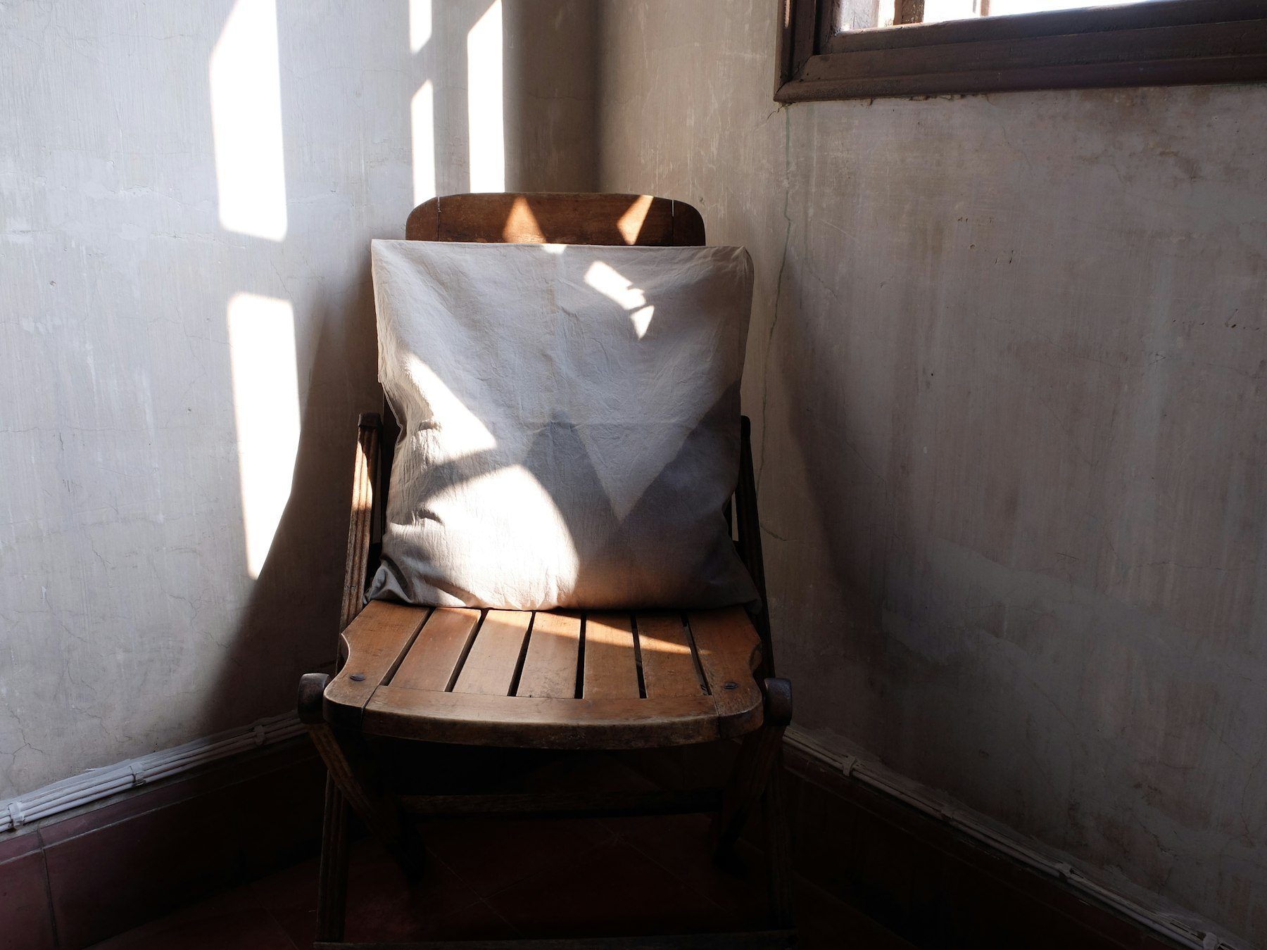 A chair with a pillow on it