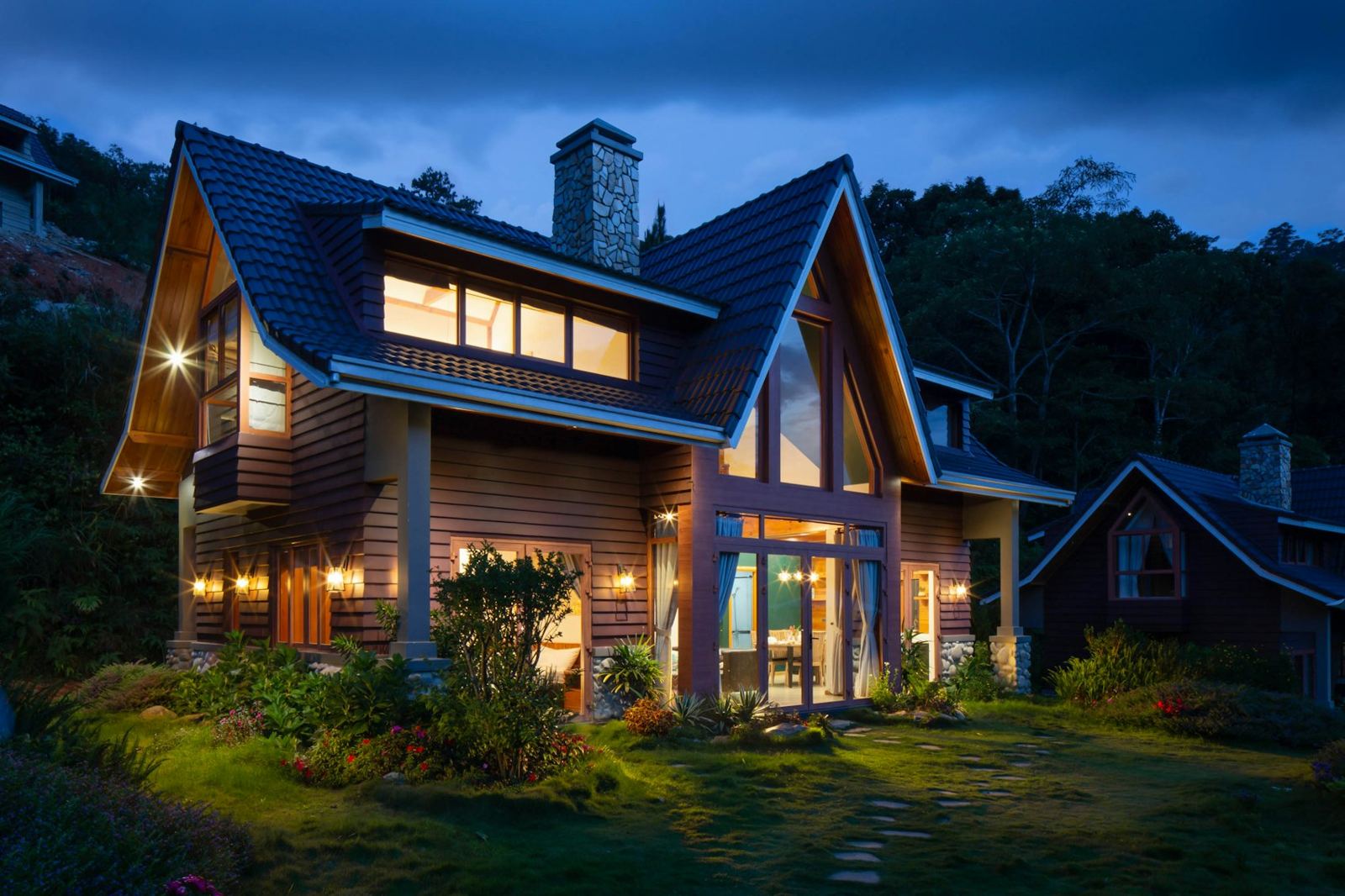 Home at dusk with warm lit windows