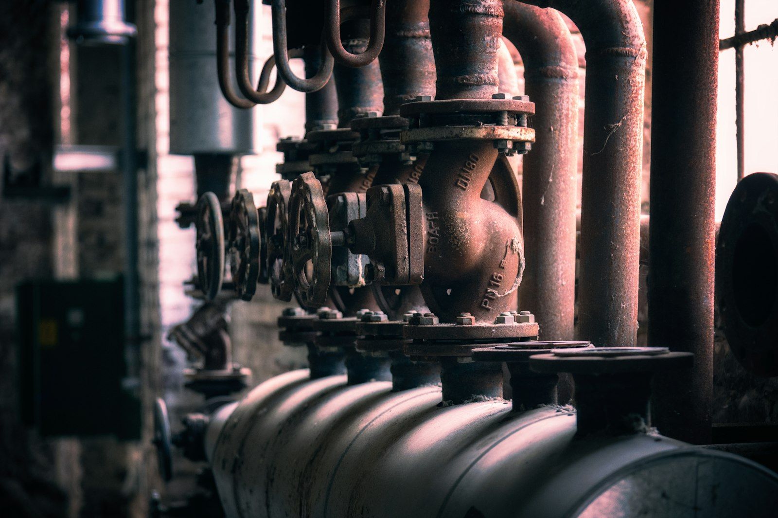 Industrial boiler room with large pipes and valves