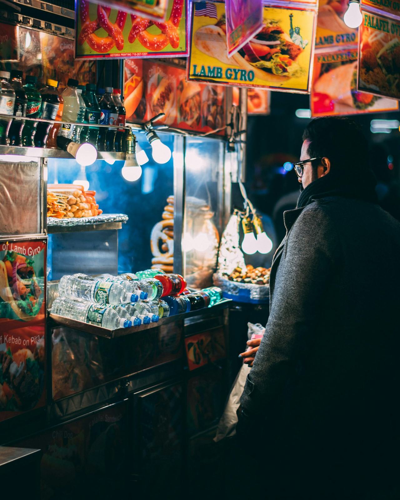 Food stall lit up at night
