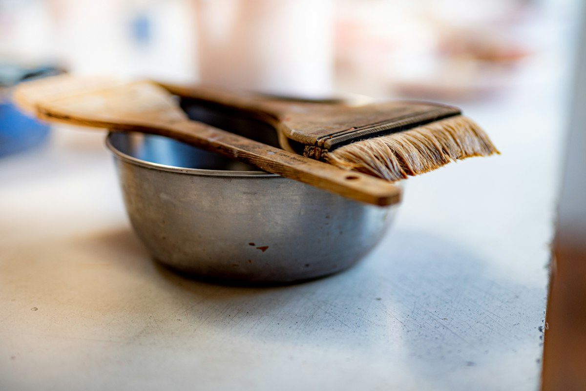Brown wooden fork on gray ceramic bowl