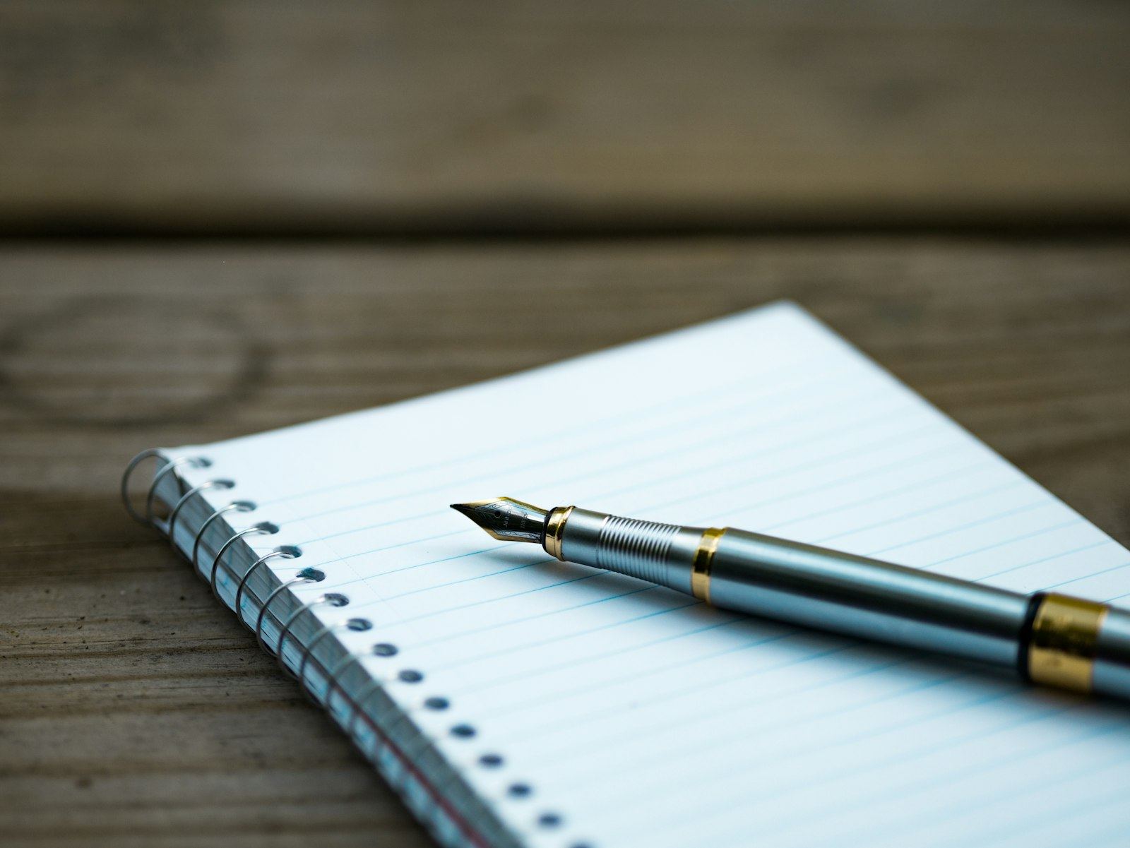 Fountain pen resting on a notebook