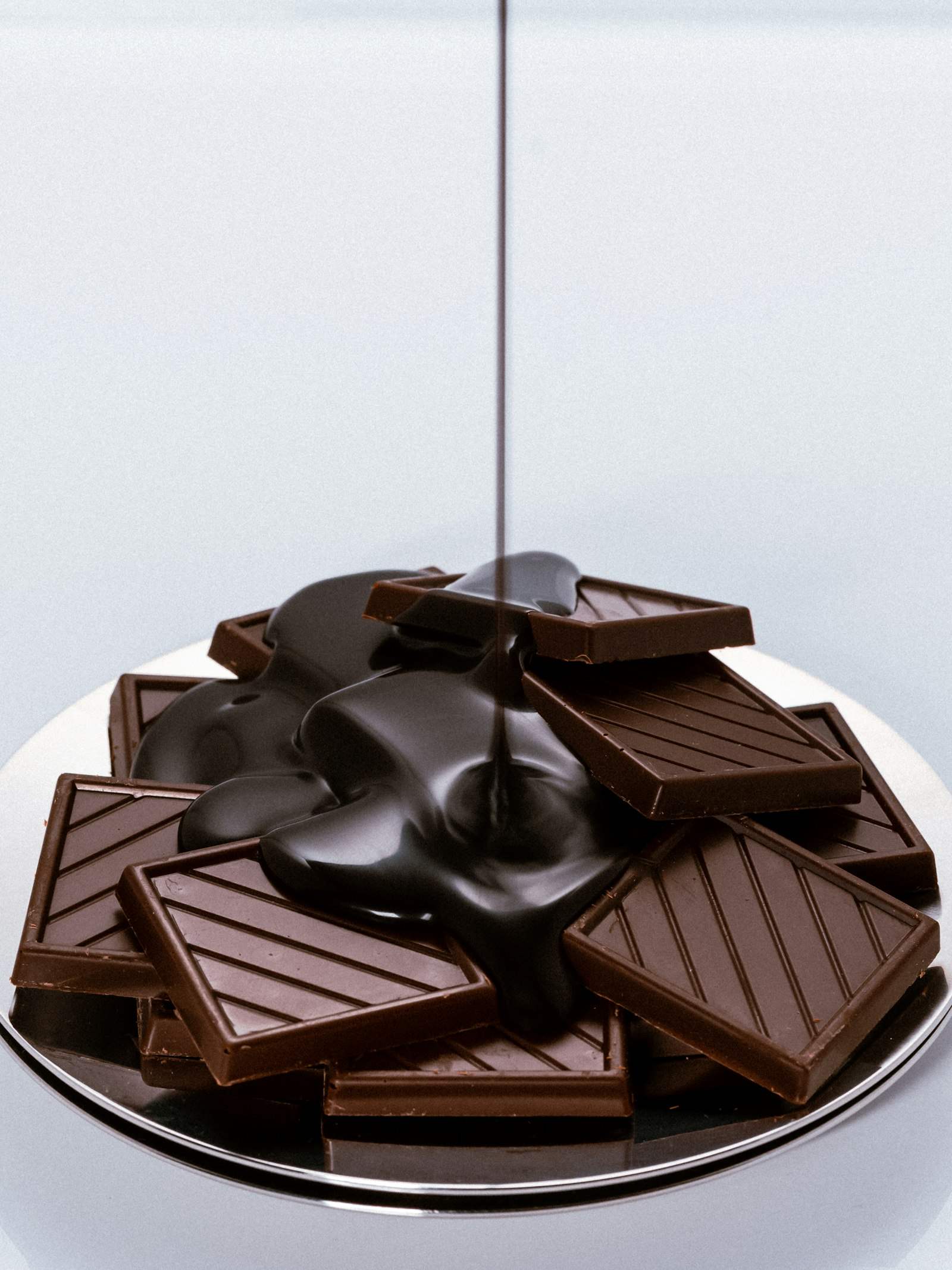 Chocolate being poured over squares