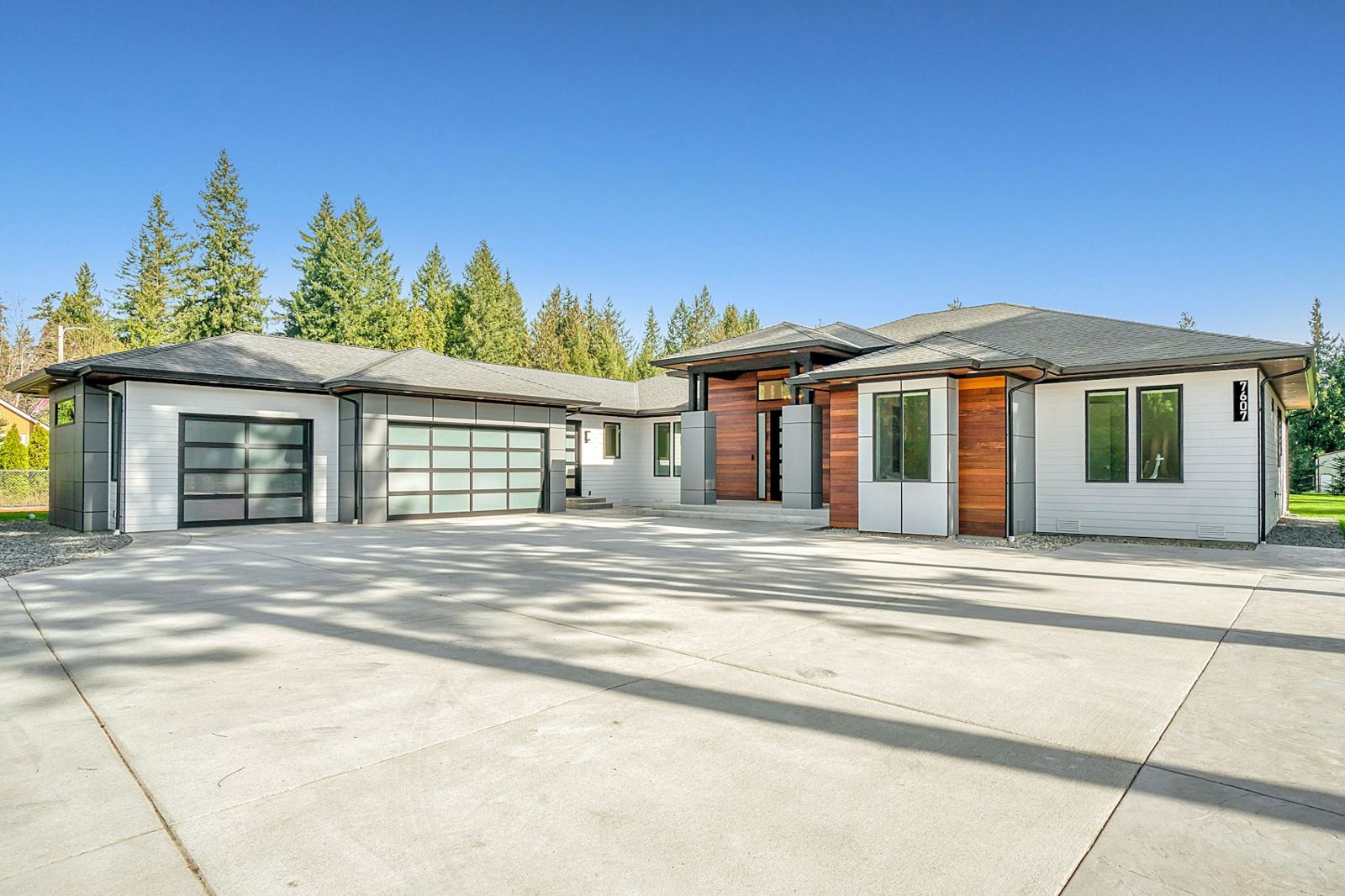 Finished home with wide concrete driveway