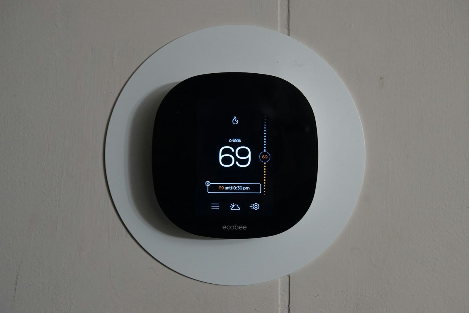 Smart thermostat on a wall
