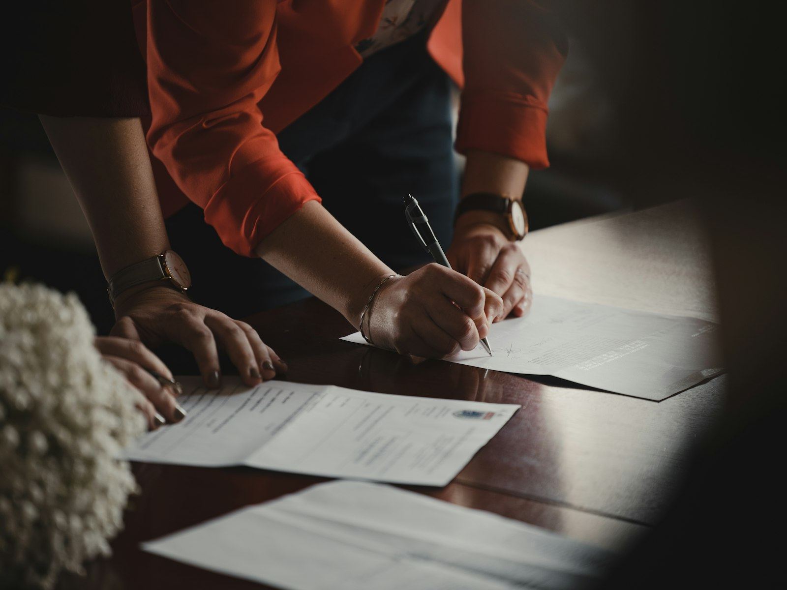 Documents being signed at a table