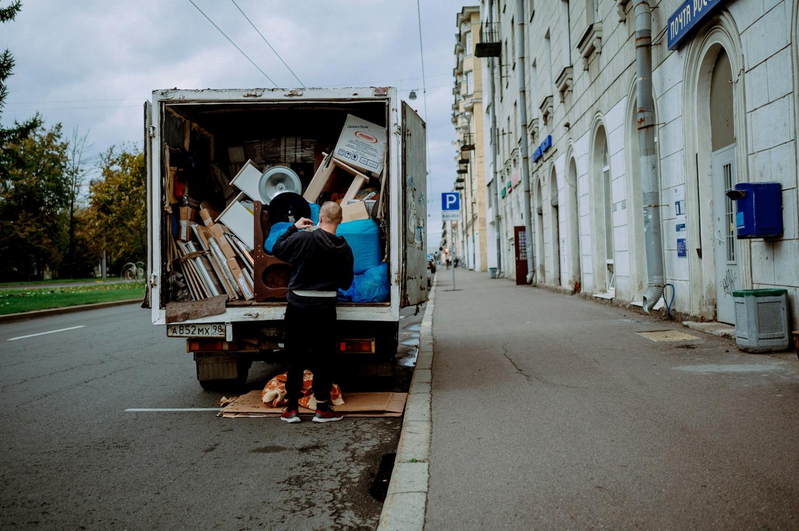 Crew loading a truck full of household items
