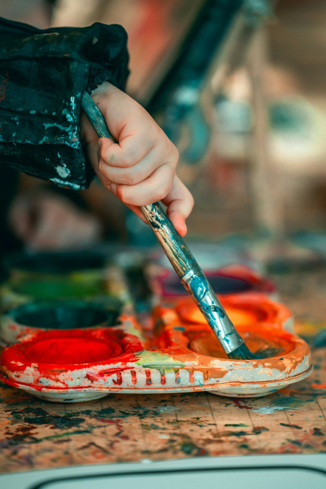 Child mixing paint