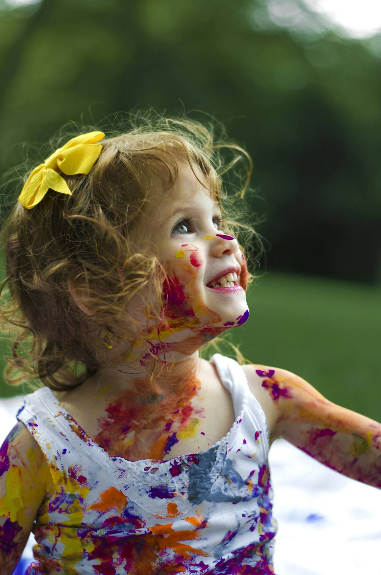 Smiling child with paint on her face