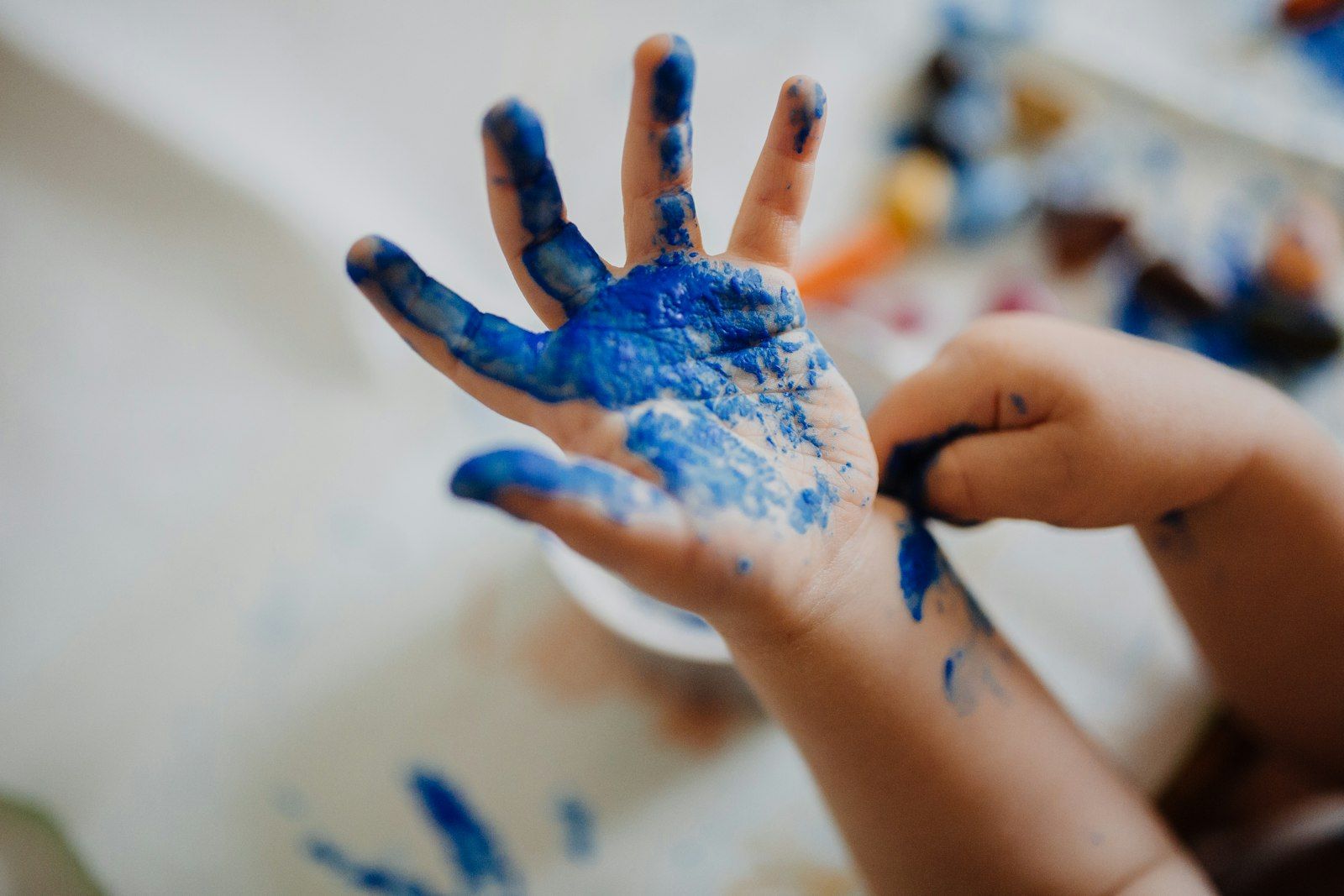 Child with paint on their hand