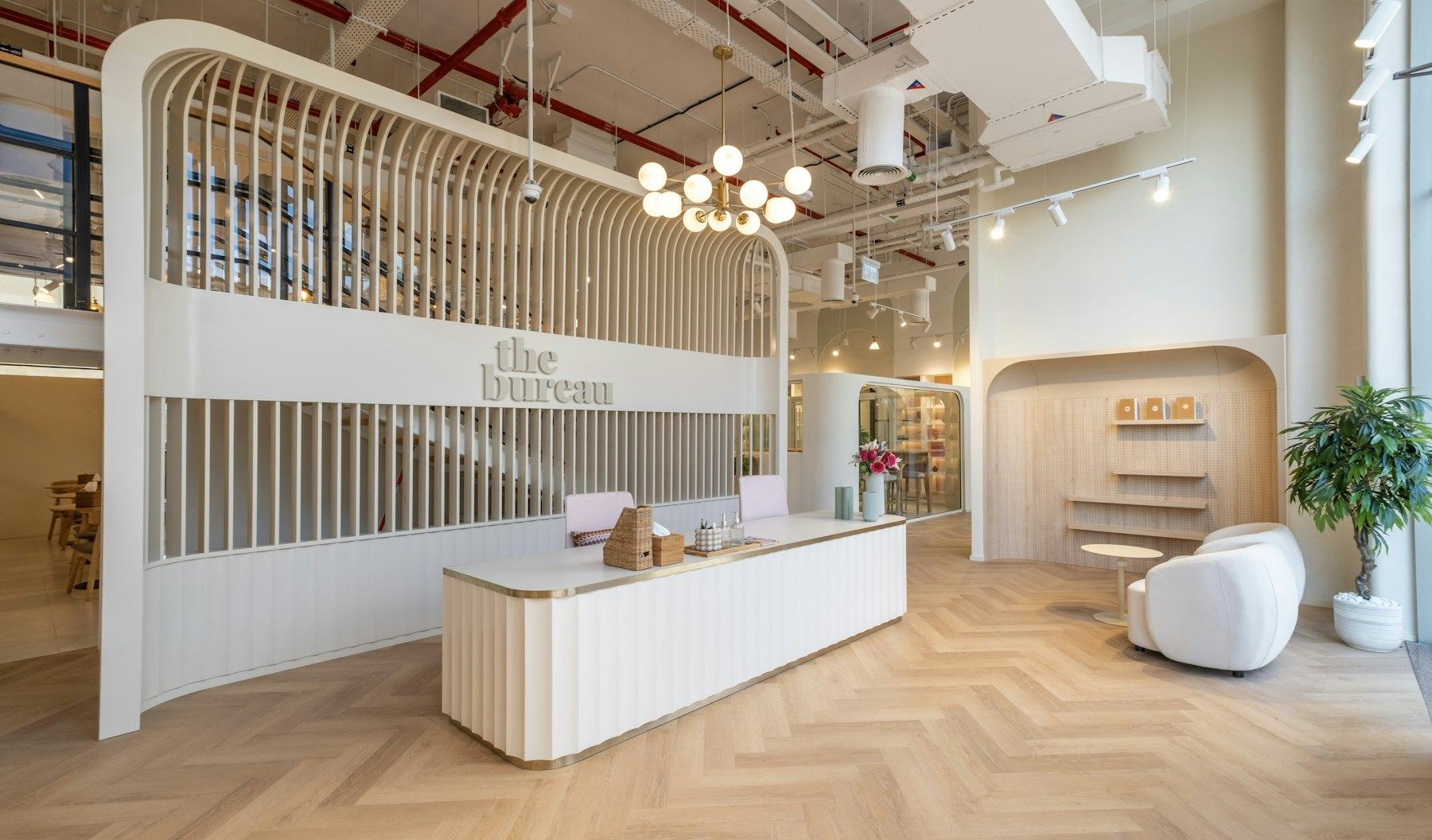 A large room with a wooden floor and white walls