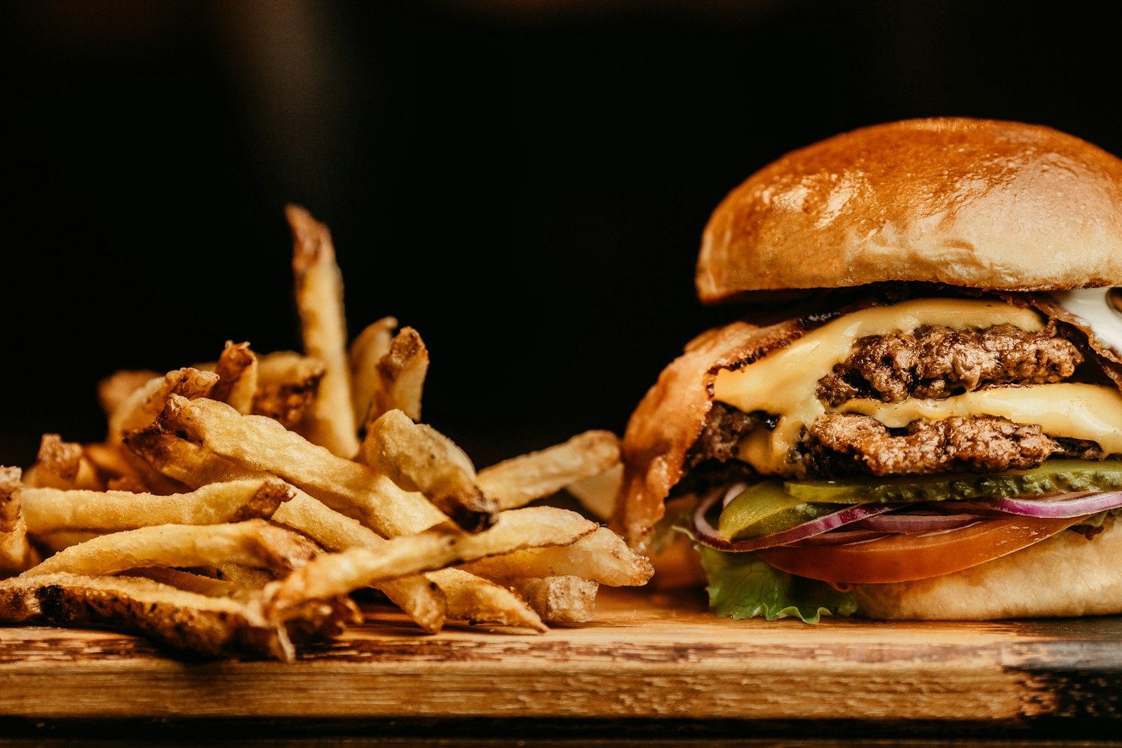 Burger with a pile of hand-cut fries