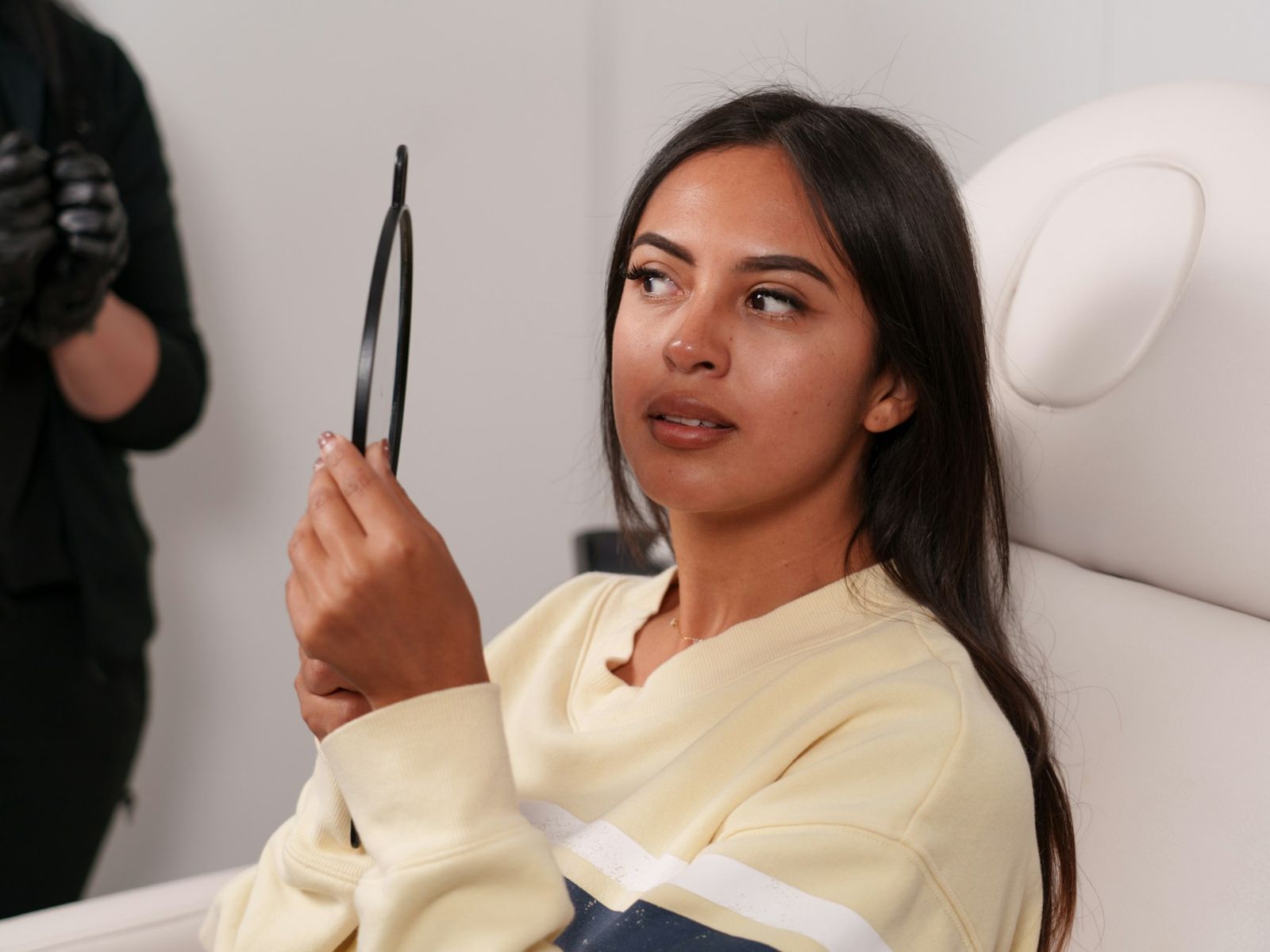 Client looking in a mirror