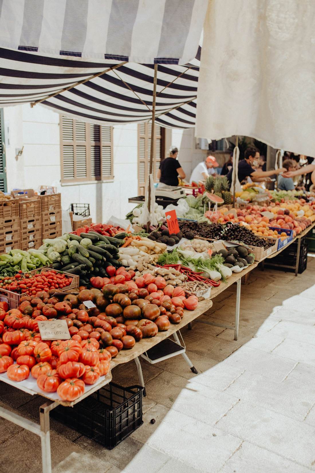 Fruit stall under striped awning
