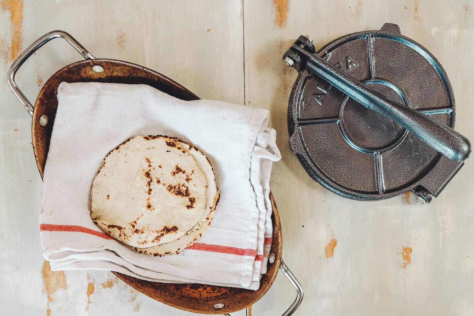 Tortilla press and warm tortilla