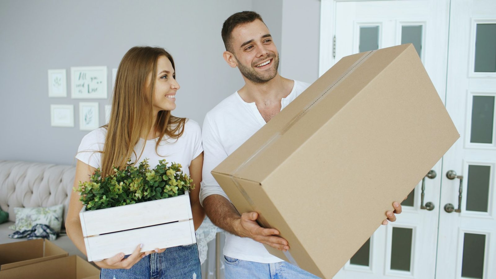 Carrying boxes into a new home