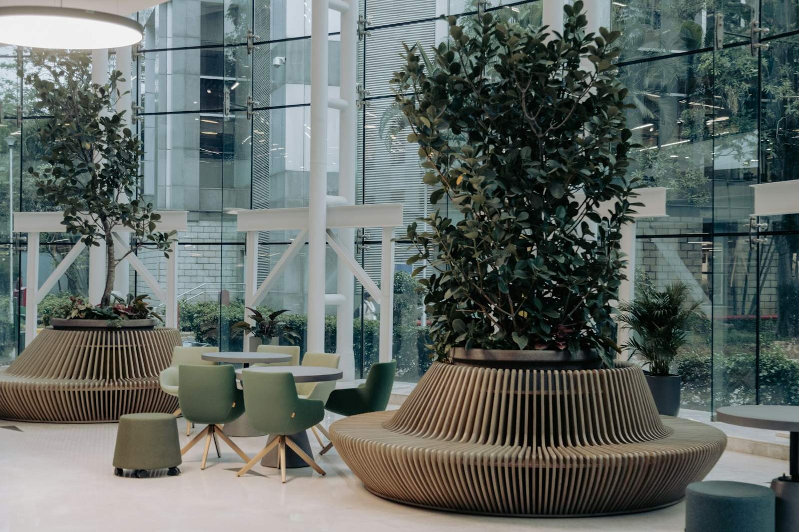Glass atrium with large planters and seating