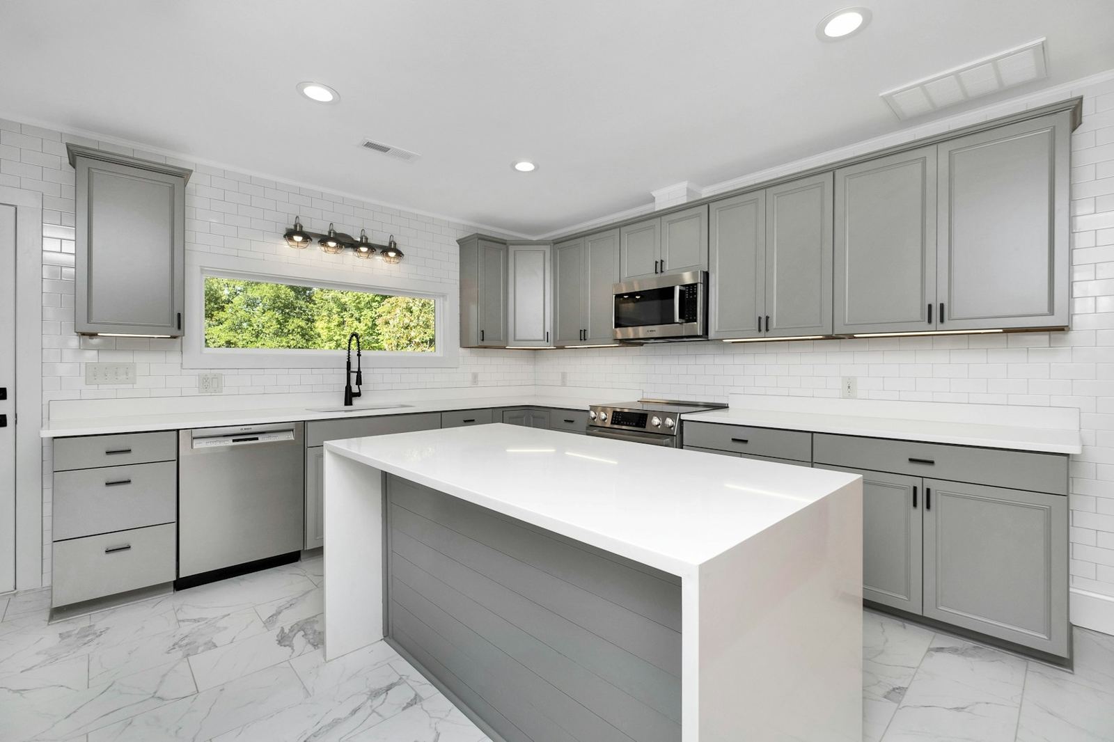 Kitchen with freshly painted gray cabinets