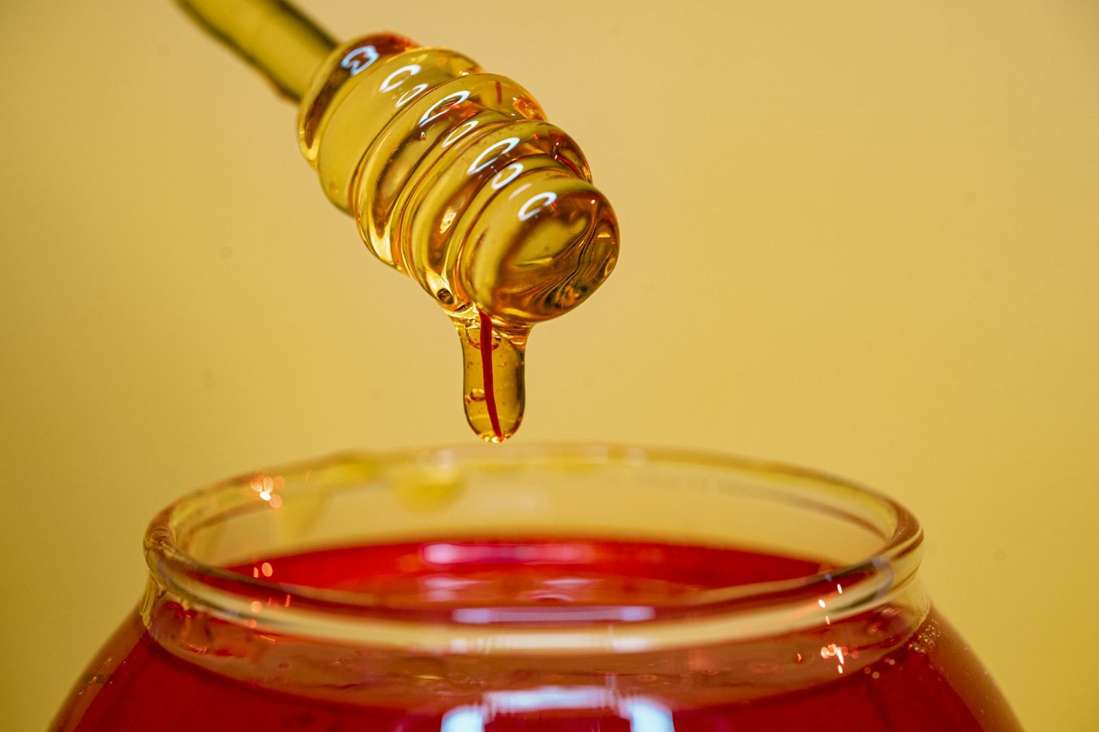 Honey dripping from a dipper