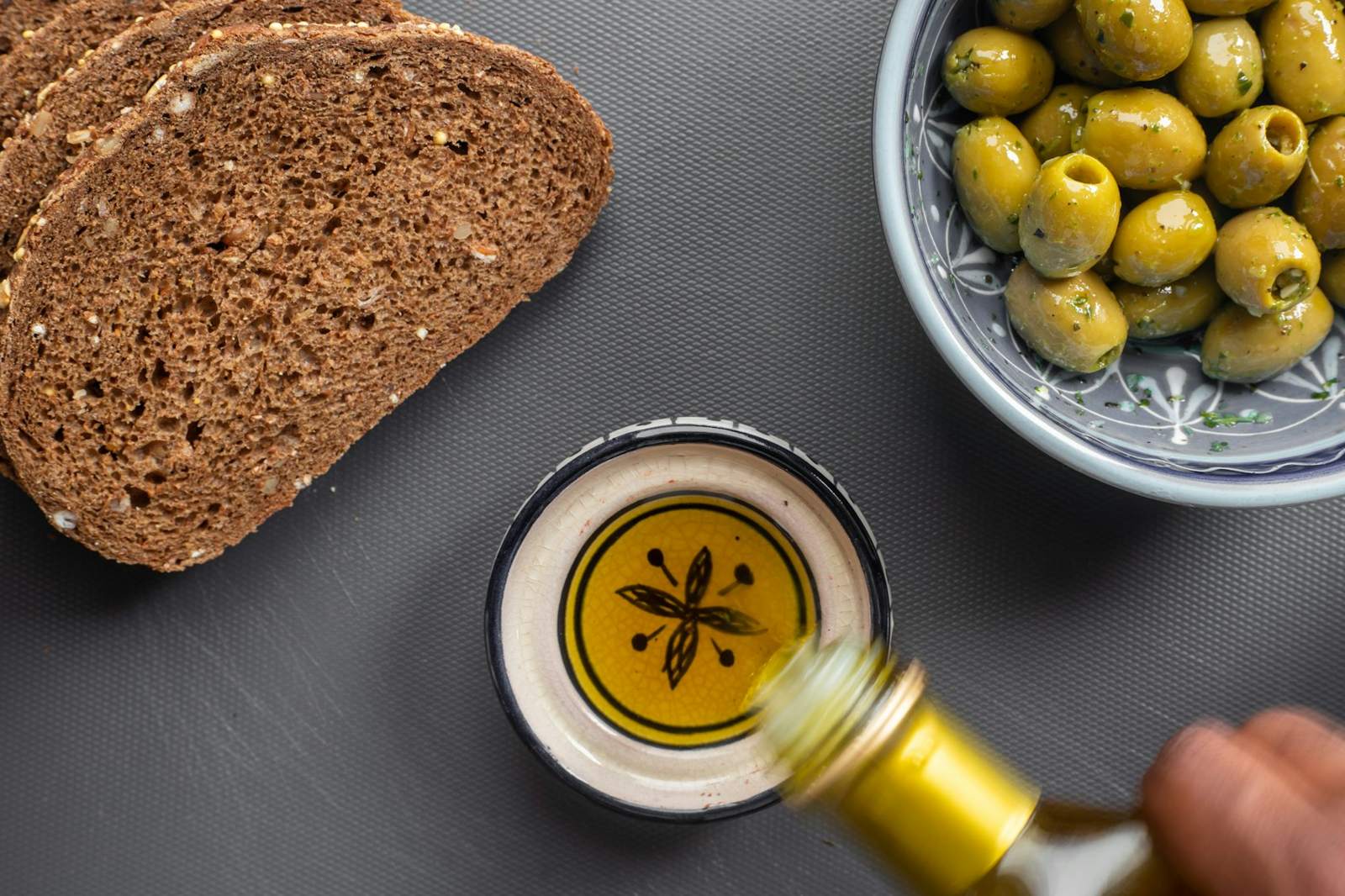 Bowl of olives, bread and oil