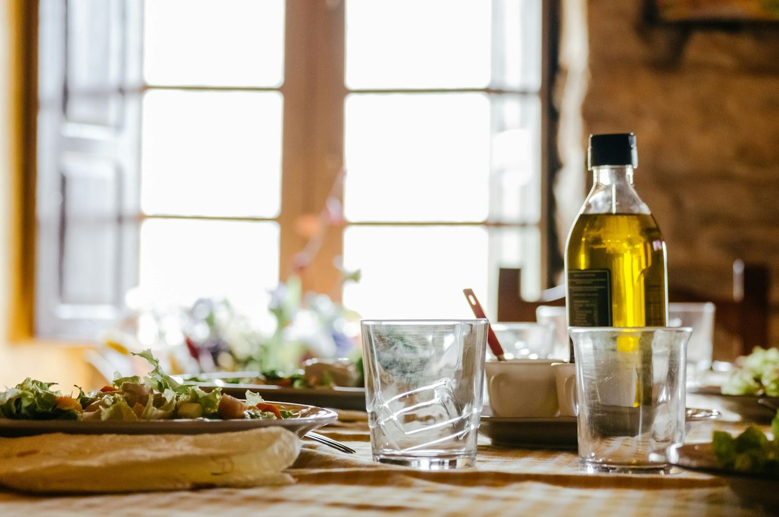 Table set with a bottle of olive oil