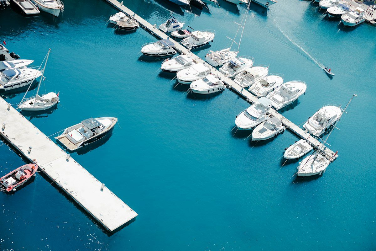 White boat on body of water during daytime