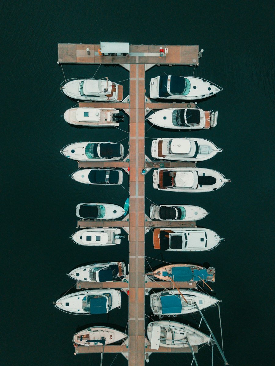 White and brown boat on body of water during daytime