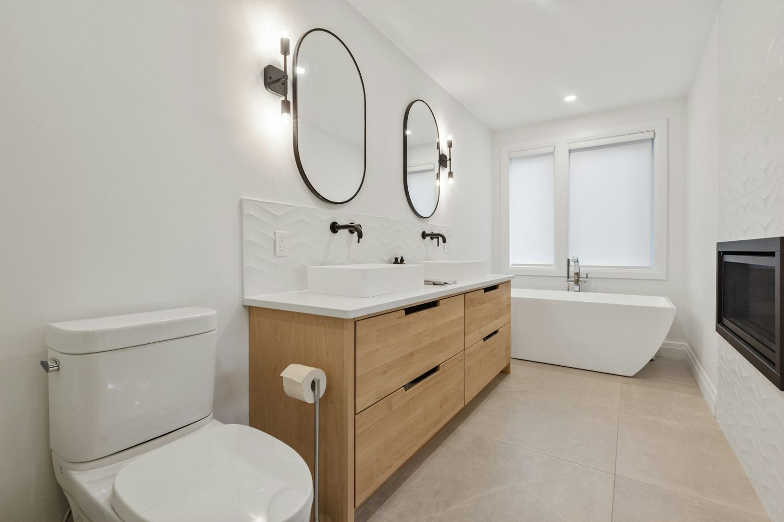 Modern bathroom with wood vanity and freestanding tub