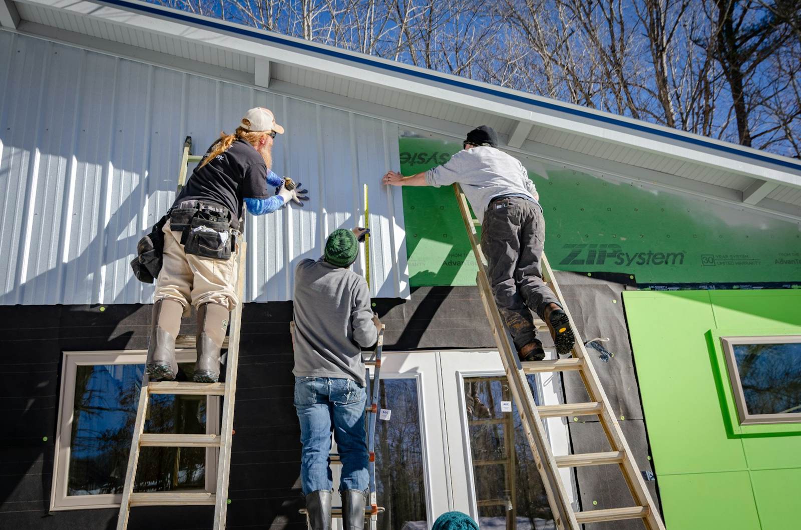 Crew installing siding