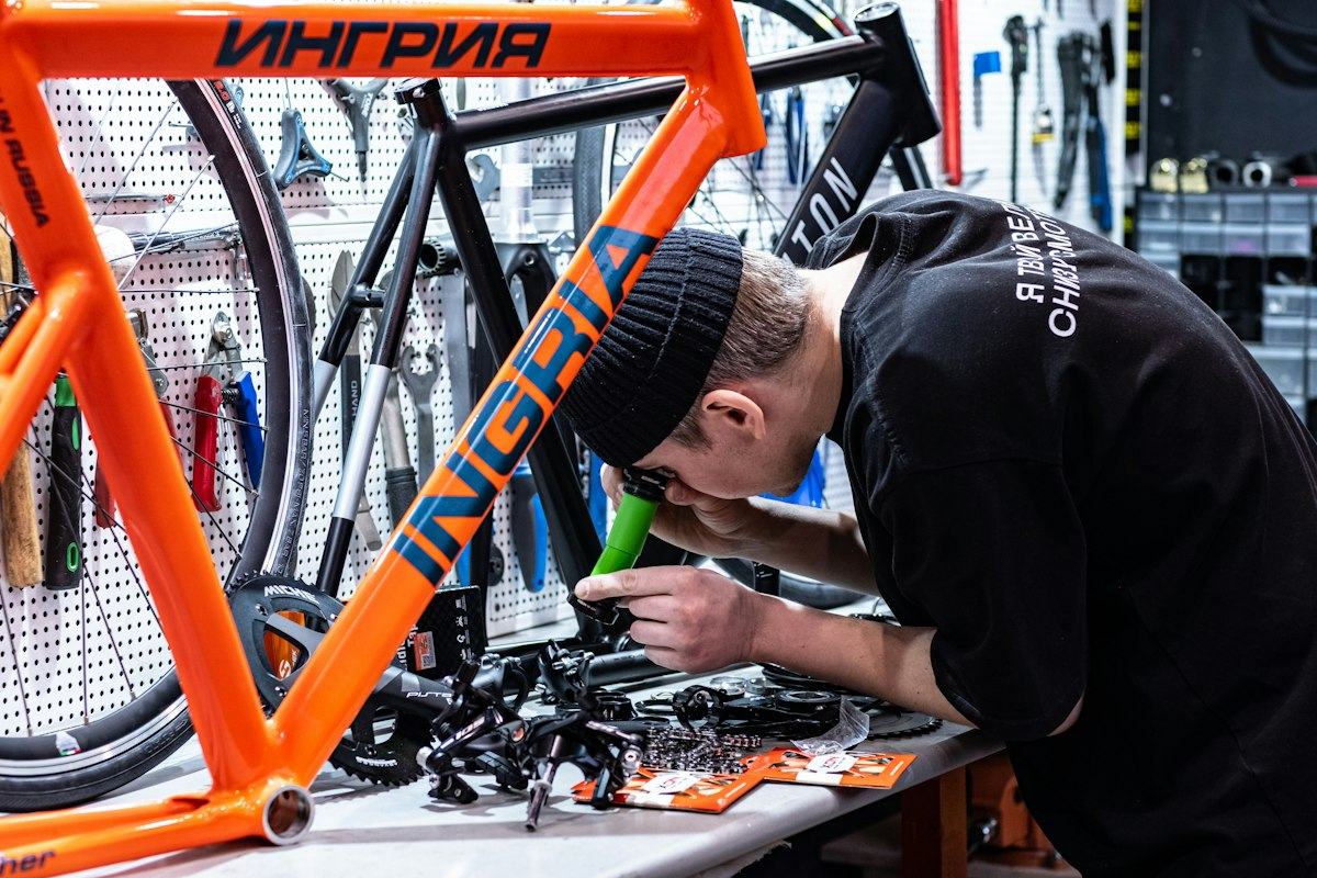 A man working on a bike in a bike shop