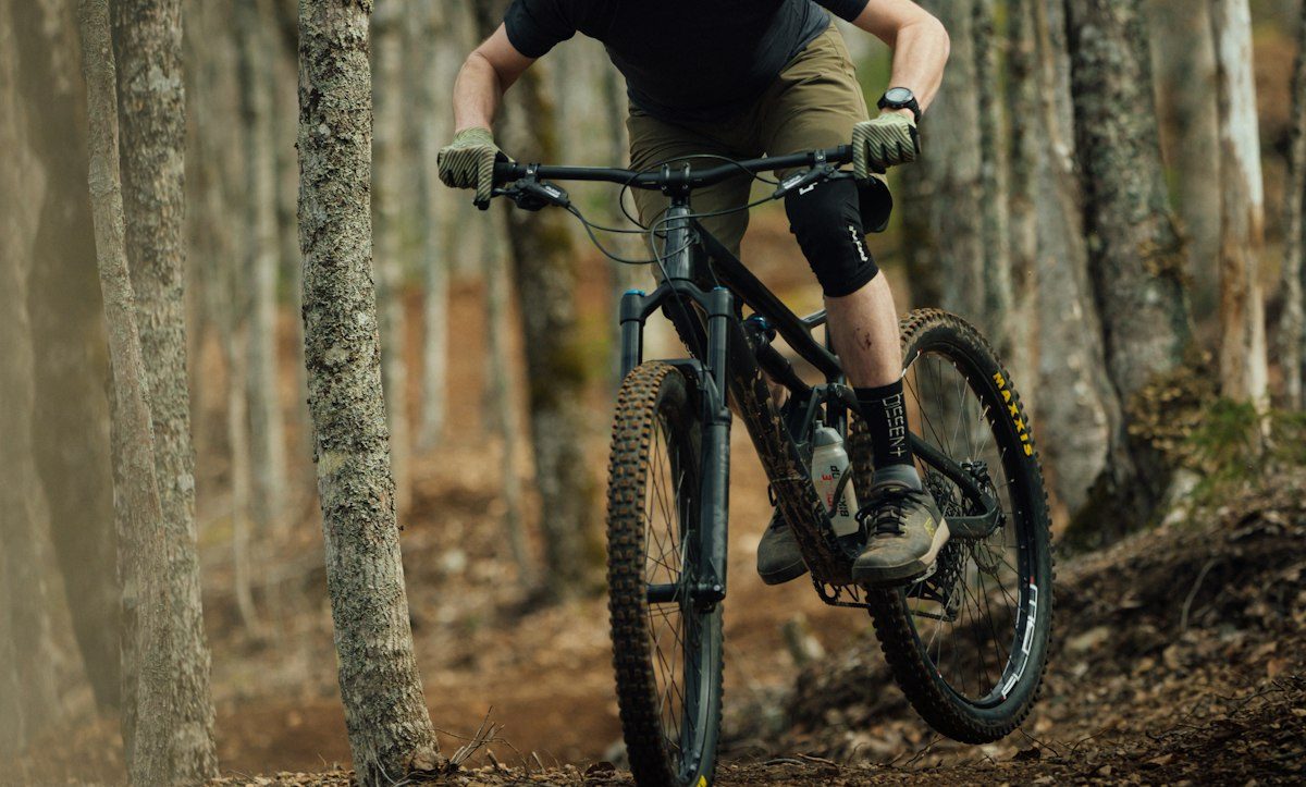 A man riding on the back of a bicycle