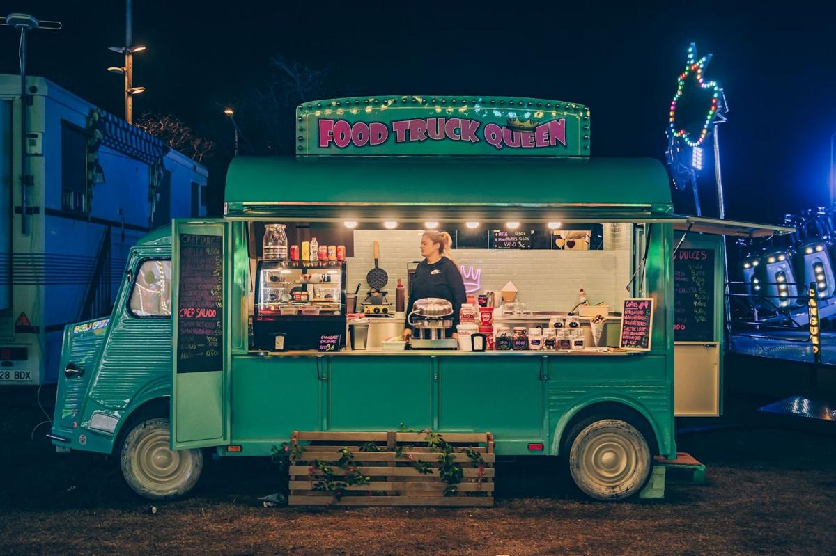 A food truck glowing at night