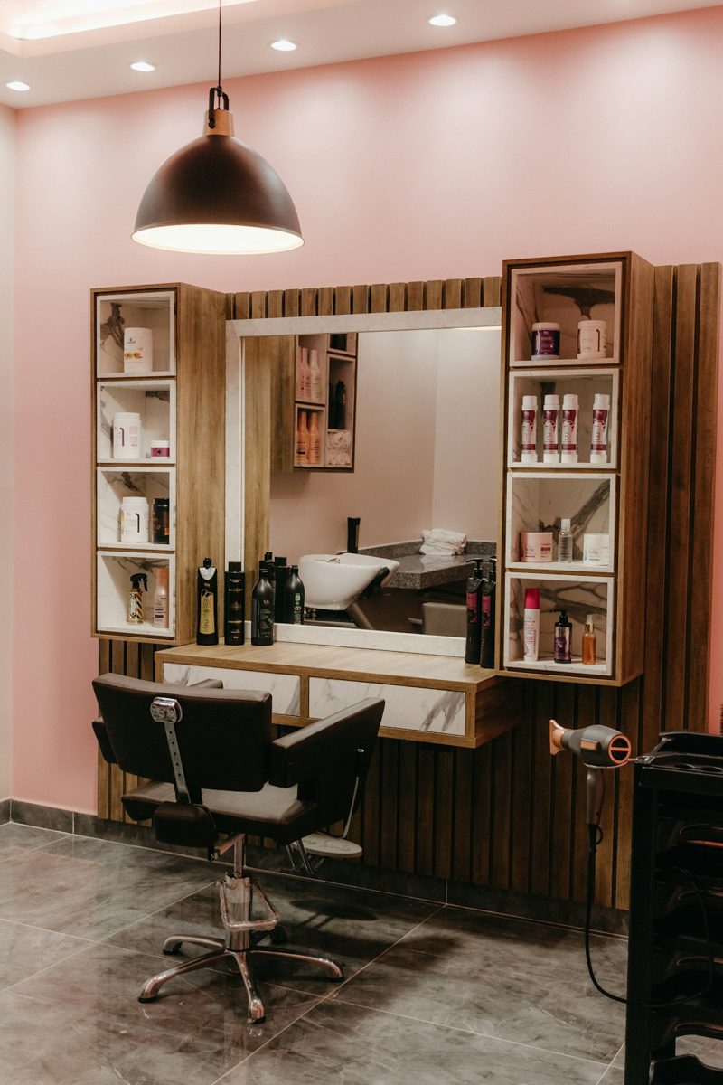 A hair salon with a chair and a mirror