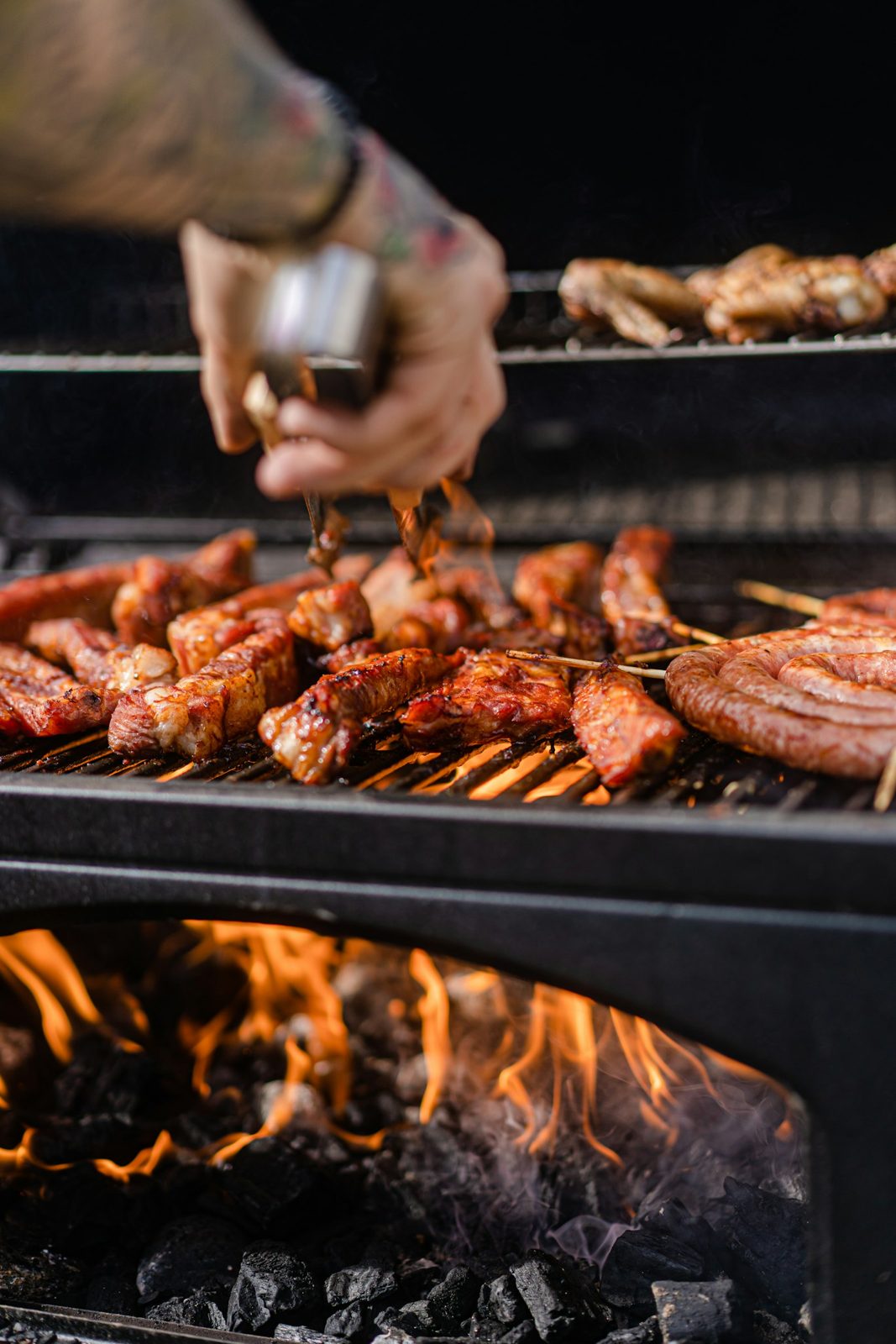 Meat over an open fire on a grill grate
