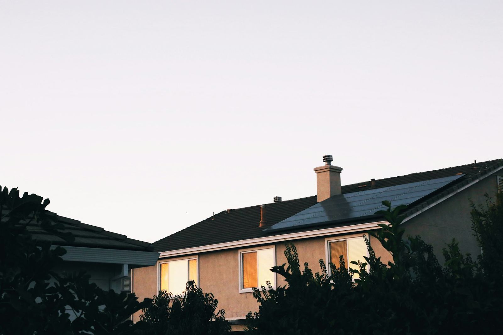 Home with solar panels at dusk