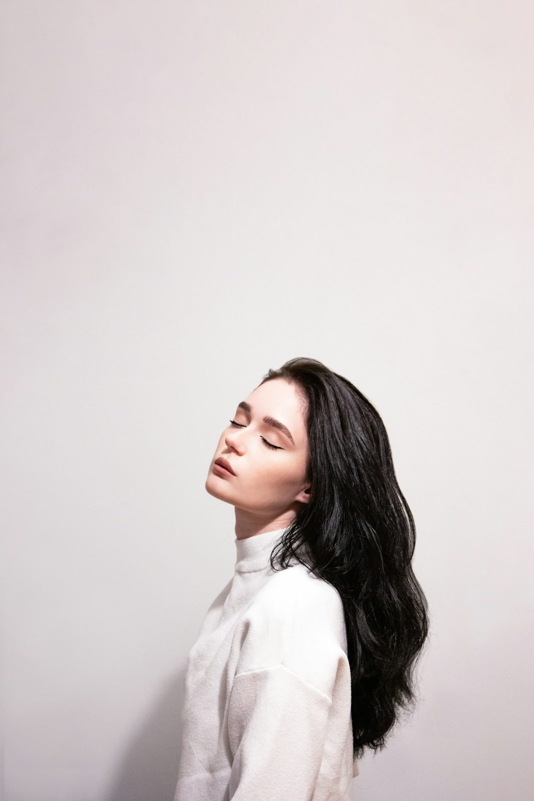 Dark-haired client in profile