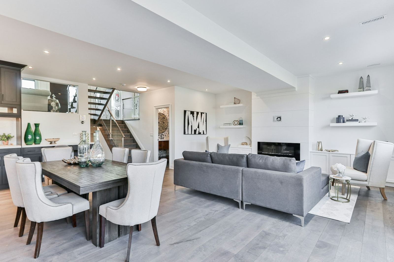 Open living and dining room with a stair